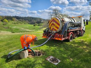 emptying a cesspit with a septic tank lorry