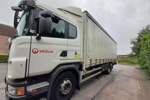 front right profile of a white fabric backed truck for sale